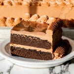 sheet pan chocolate birthday cake slice on plate.