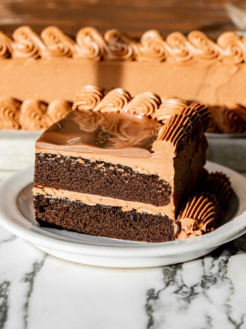 sheet pan chocolate birthday cake slice on plate.