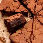 9" Flourless Chocolate Cake cut into triangles.