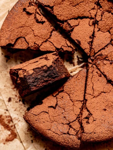 9" Flourless Chocolate Cake cut into triangles.