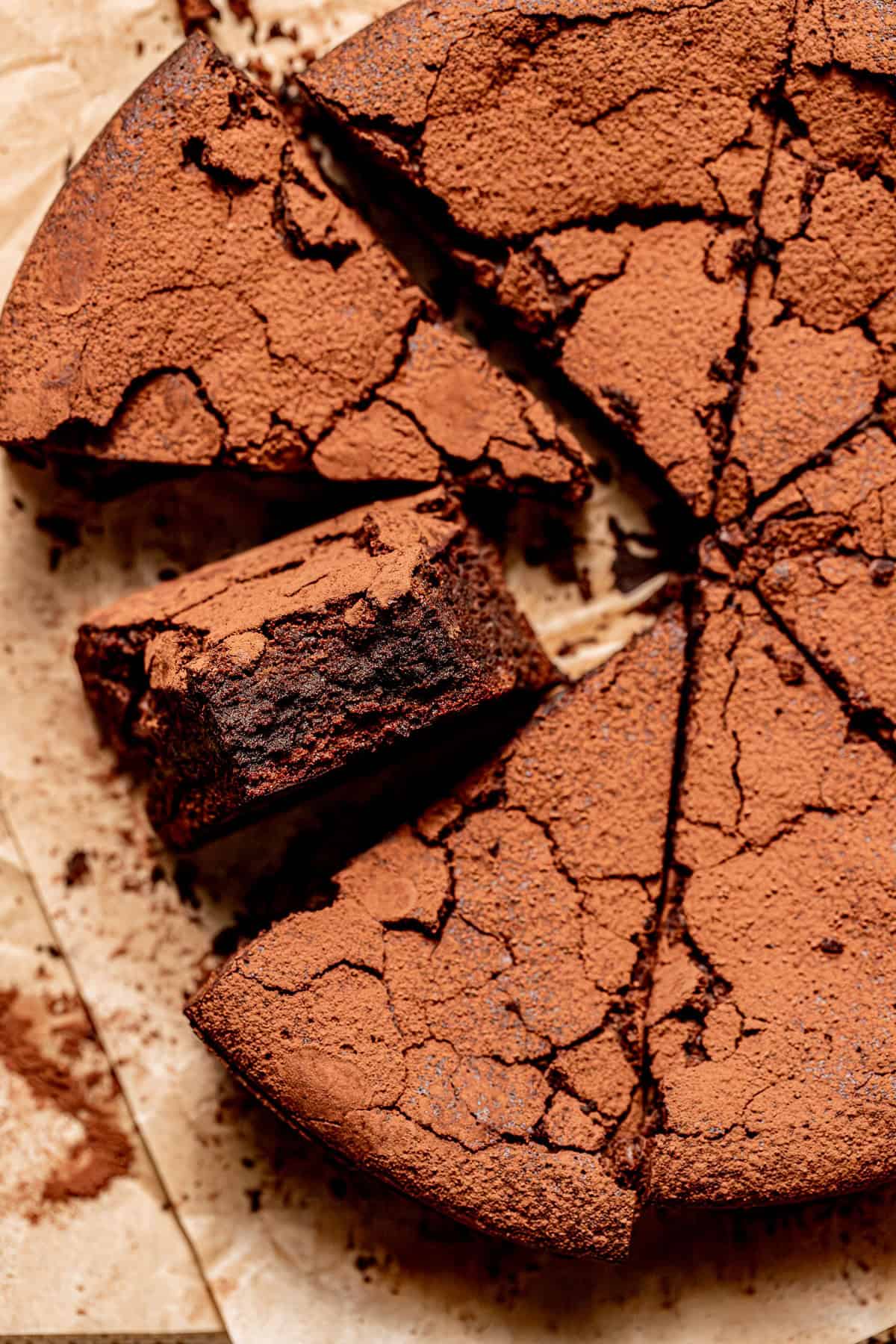 9" Flourless Chocolate Cake cut into triangles.