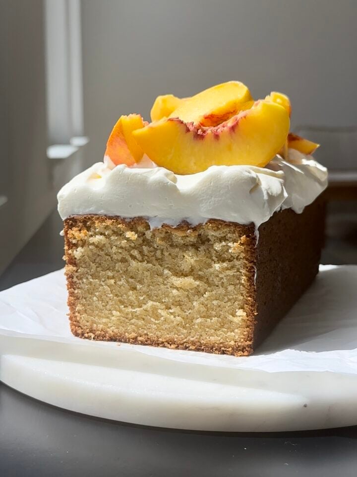 Peach Shortcake Cake on marble round.