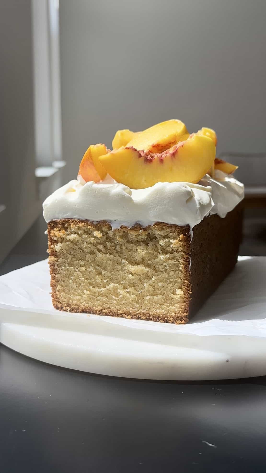 Peach Shortcake Cake on marble round.