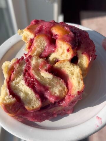 Roasted Raspberry Sweet Roll cut in half.