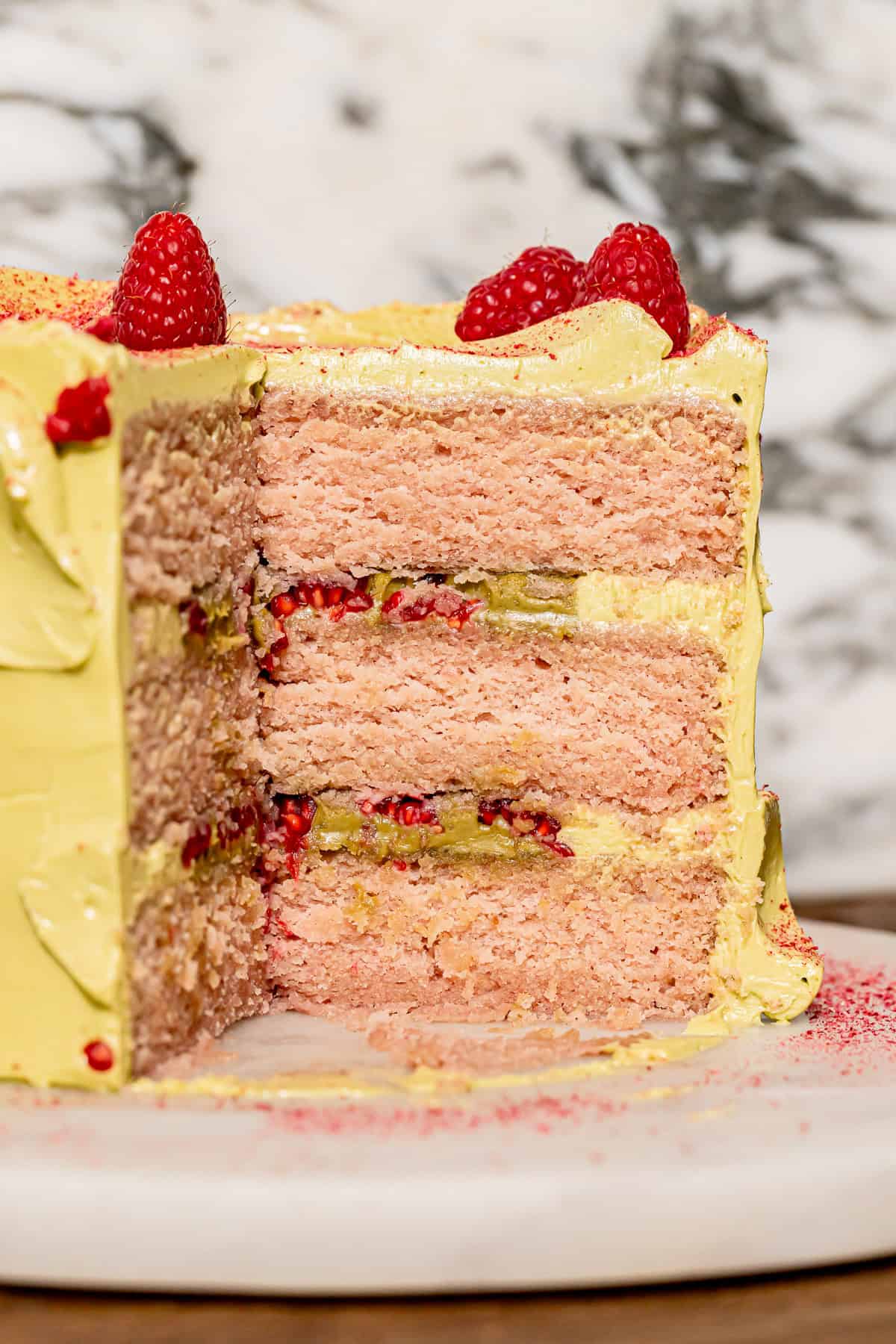 Pistachio Raspberry Cake cut to show inside texture.