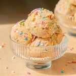 edible cookie dough in glass cup.