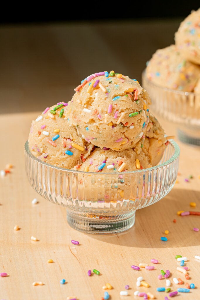 edible cookie dough in glass cup.