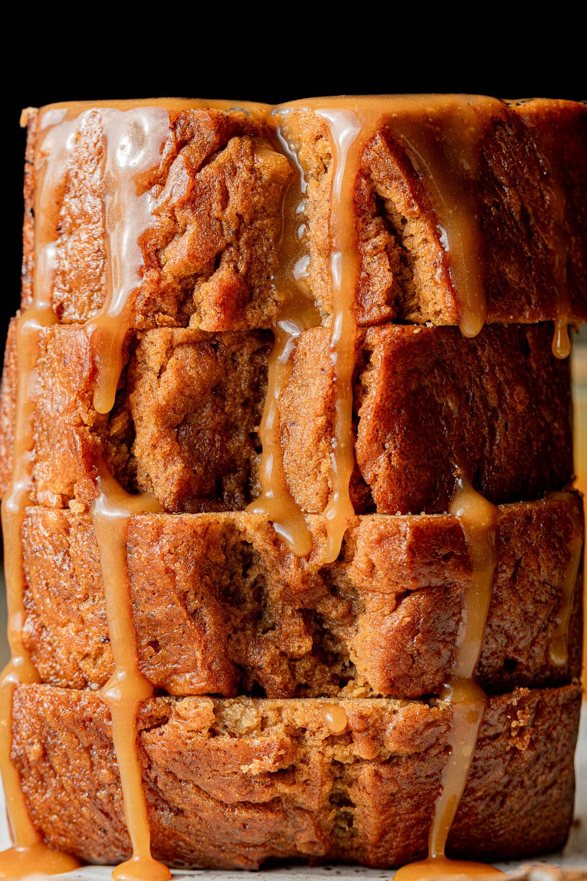 bourbon banana bread slices stacked.