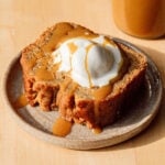 bourbon banana bread slice on plate with ice cream.