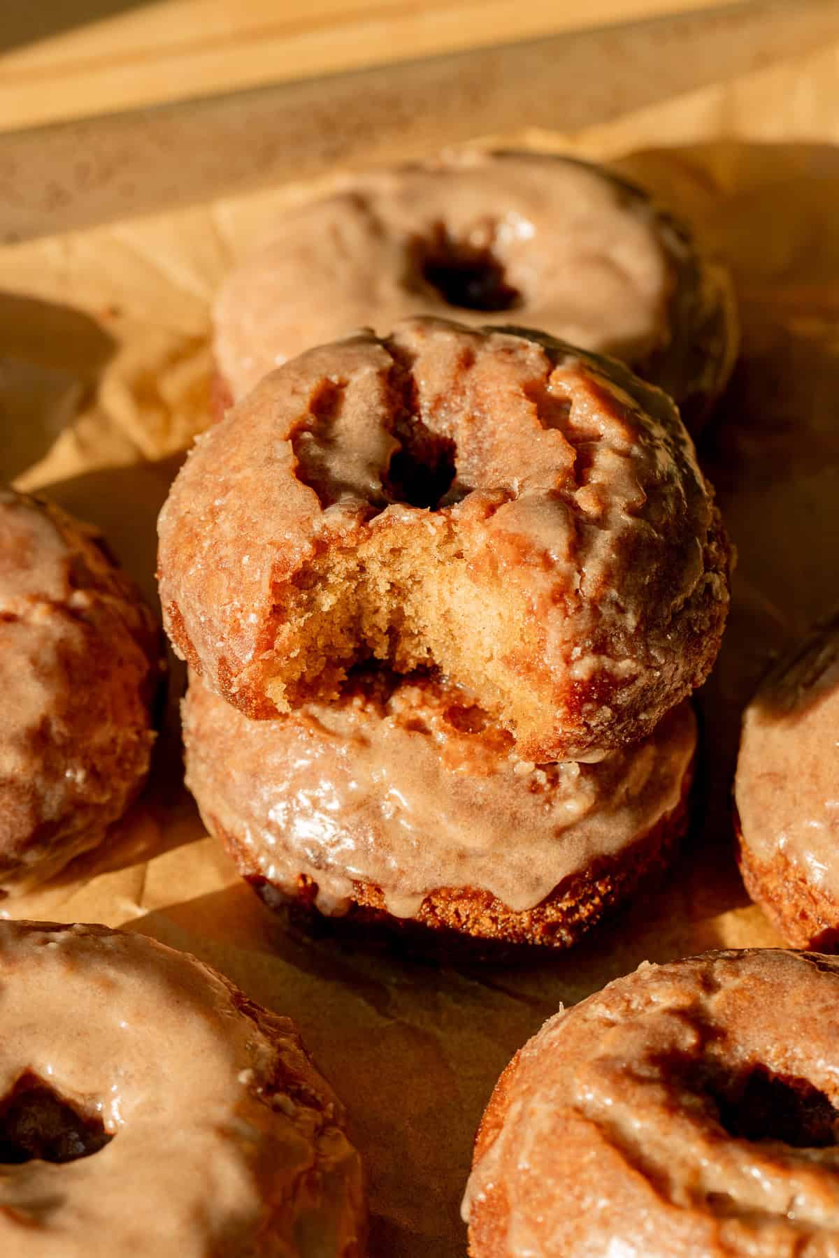 Old-Fashioned Banana Bread Donuts stacked.