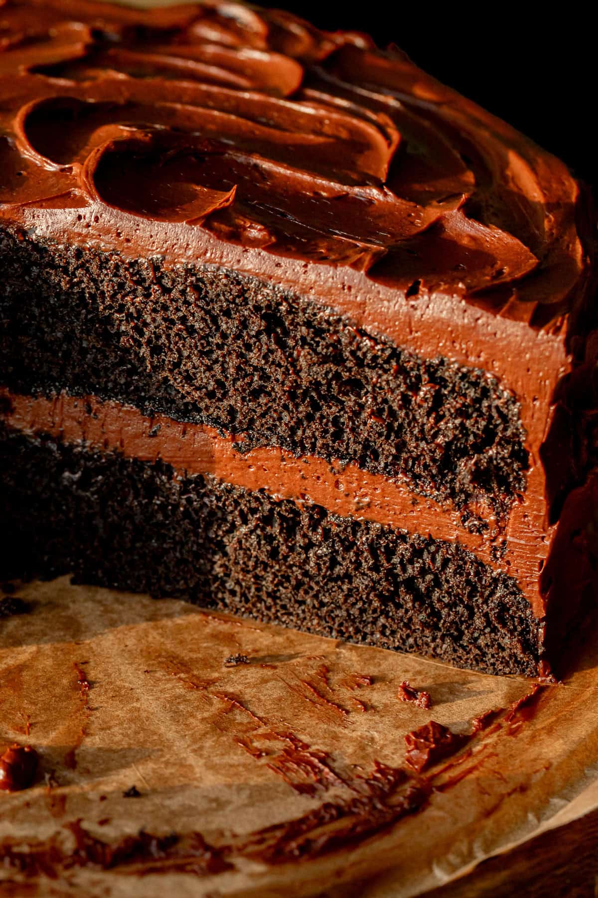 chocolate ganache cake cut to reveal inside texture.