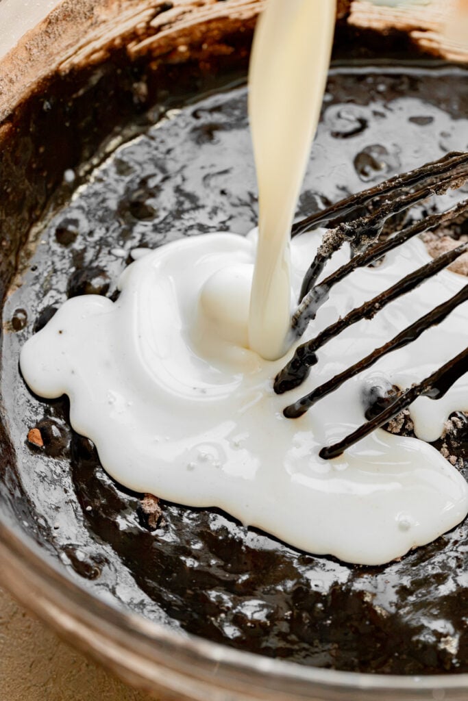 buttermilk being poured into batter.