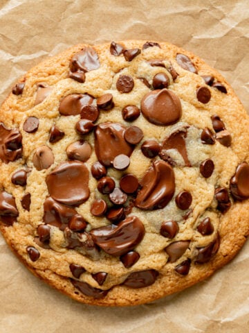 single serve chocolate chip cookie on parchment paper.