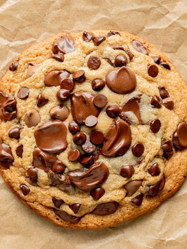single serve chocolate chip cookie on parchment paper.