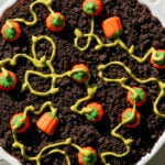 pumpkin patch dirt pudding cake in white dish.