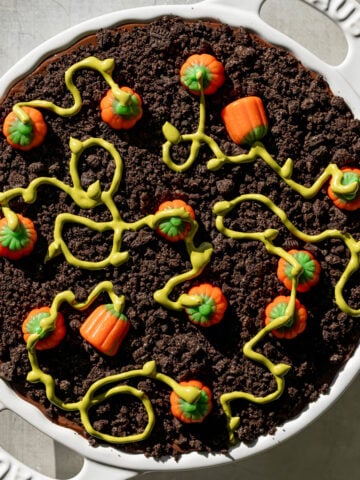 pumpkin patch dirt pudding cake in white dish.