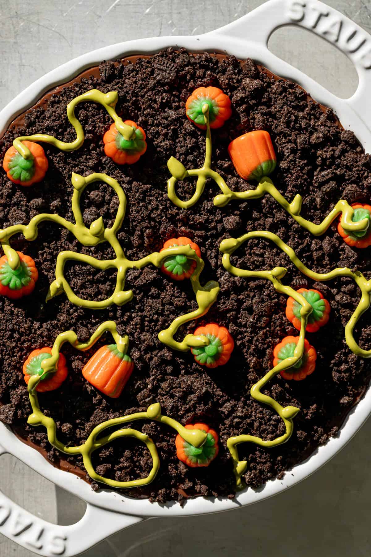 pumpkin patch dirt pudding cake in white dish.