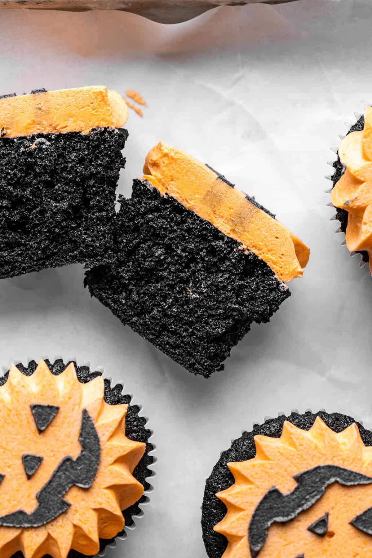 Black Velvet Jack-O’-Lantern Cupcake cut in half. 