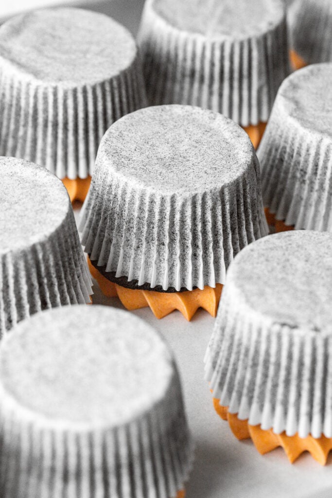 cupcakes upside down on parchment paper.