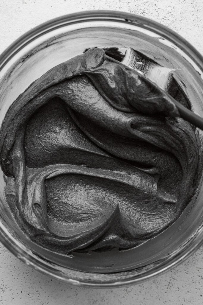 black buttercream in bowl.