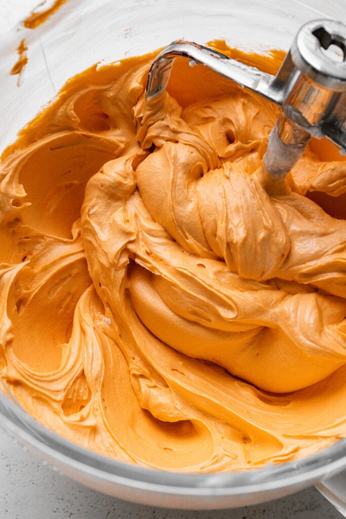 orange buttercream in bowl.