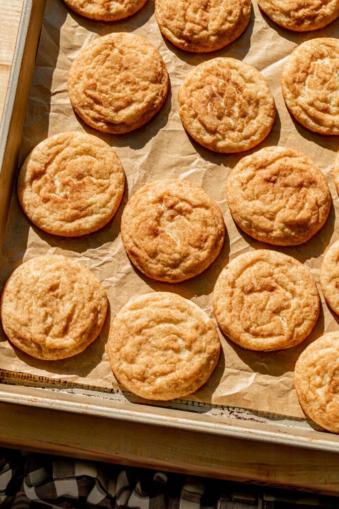 baked Thick & Soft Snickerdoodles on baking sheet.