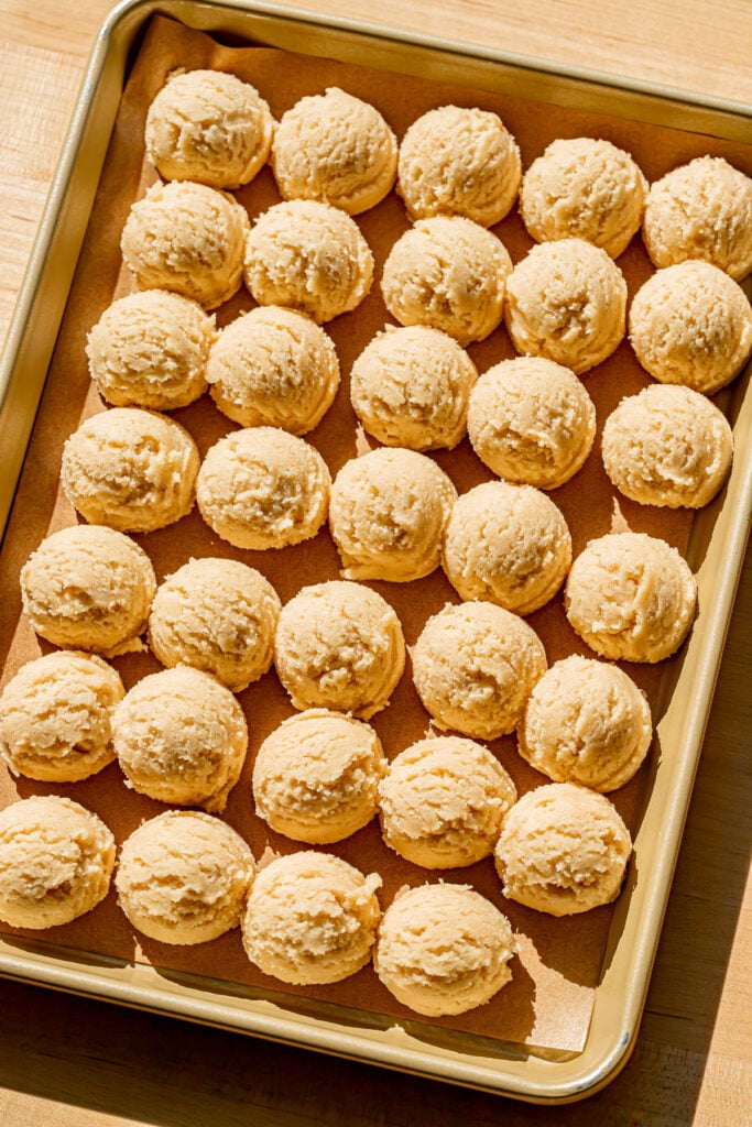 portioned cookie dough on baking sheet.