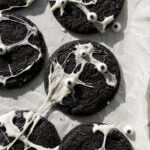 spiderweb black velvet cheesecake cookies on baking sheet.