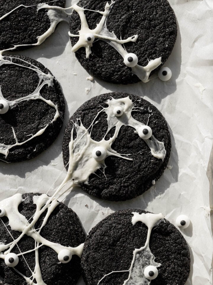 spiderweb black velvet cheesecake cookies on baking sheet.