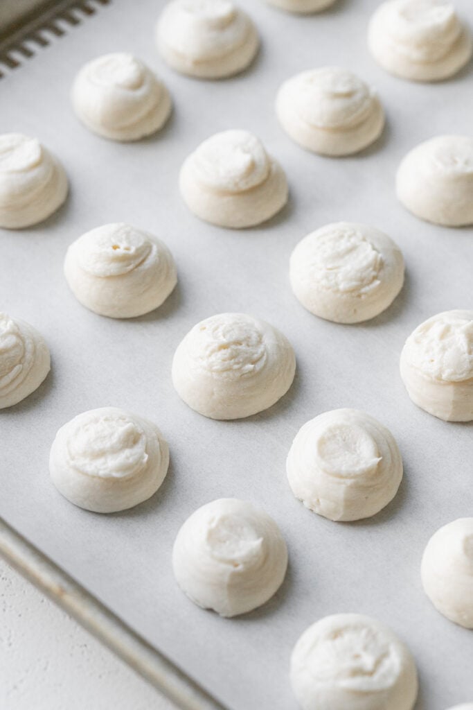 cheesecake dollops on baking sheet.